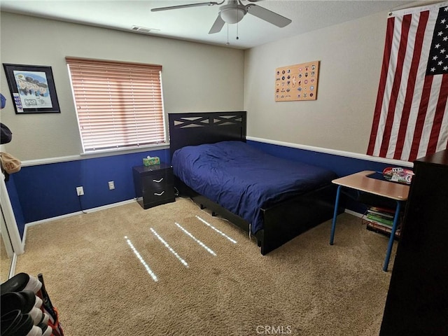 carpeted bedroom featuring visible vents, ceiling fan, and baseboards