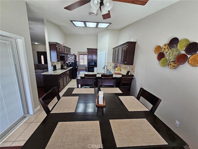 dining room with ceiling fan, light tile patterned flooring, and visible vents