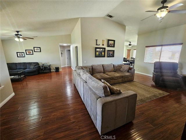 living room featuring baseboards, visible vents, ceiling fan, wood finished floors, and high vaulted ceiling