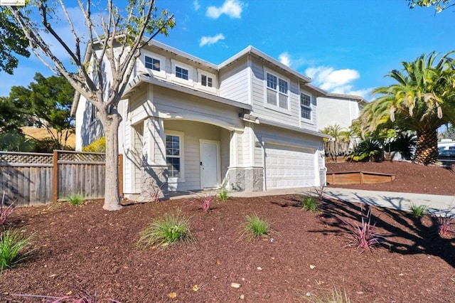 view of front of property with a garage