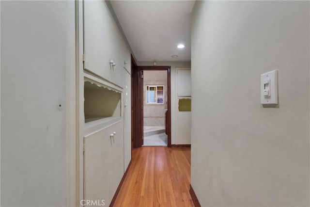 hallway featuring light hardwood / wood-style flooring