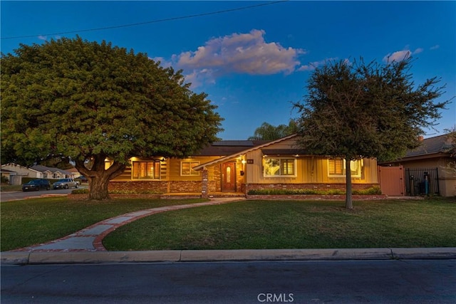 view of front of house with a yard