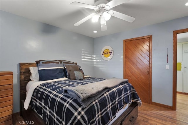 bedroom featuring ceiling fan and wood-type flooring