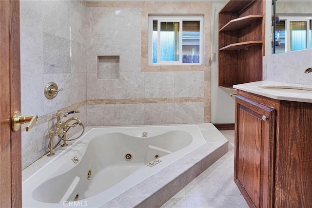 bathroom featuring vanity, tile patterned floors, and tiled tub