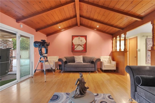 living room featuring light hardwood / wood-style floors, lofted ceiling with beams, and wood ceiling