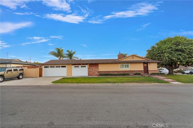 ranch-style home with a front lawn and a garage