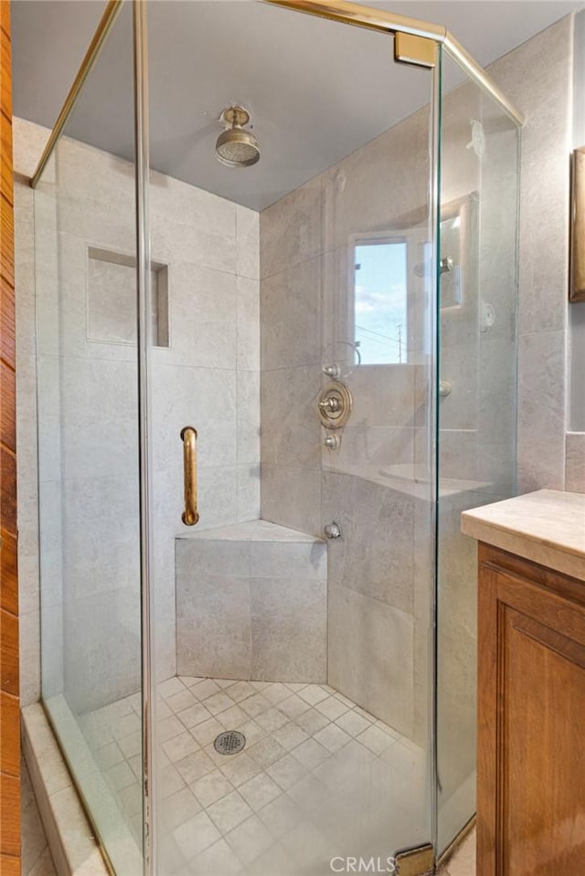 bathroom with vanity and walk in shower