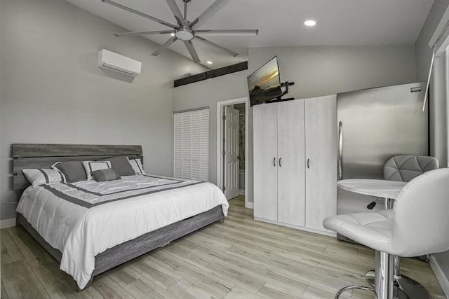 bedroom with lofted ceiling, light hardwood / wood-style floors, an AC wall unit, and ceiling fan