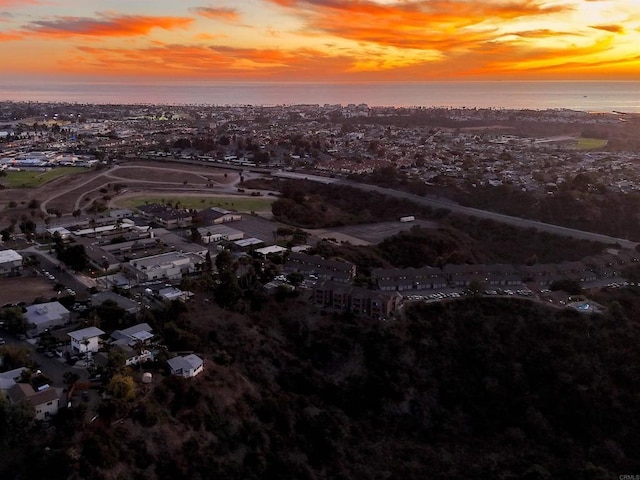 aerial view at dusk with a water view