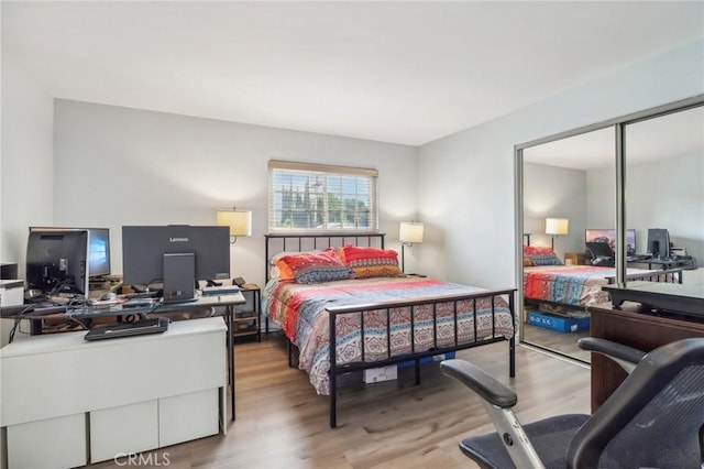 bedroom featuring a closet and light hardwood / wood-style flooring