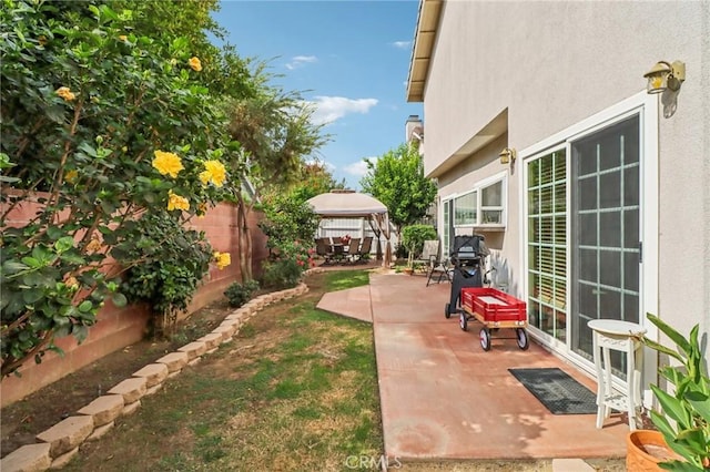 view of yard with a gazebo and a patio area