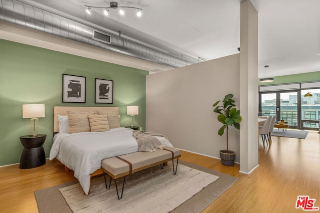 bedroom featuring light wood-type flooring