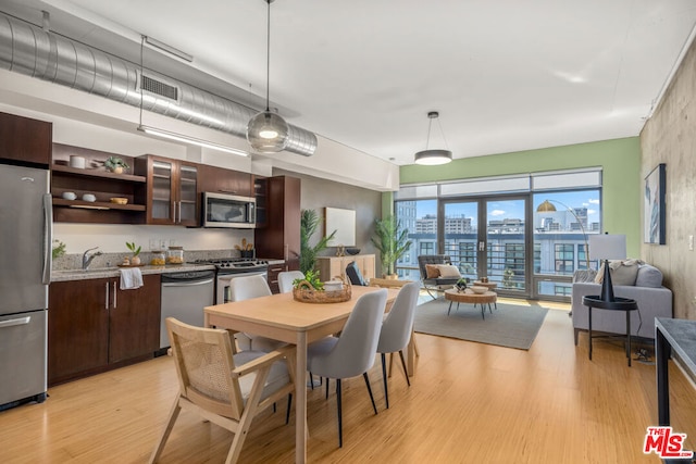 dining space with light hardwood / wood-style flooring