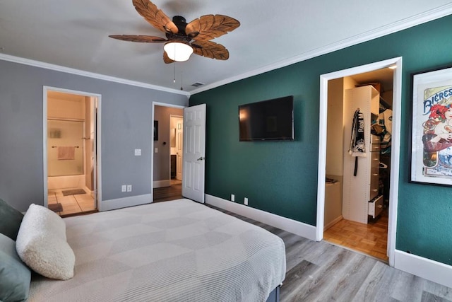 bedroom featuring ensuite bathroom, crown molding, ceiling fan, and light hardwood / wood-style flooring