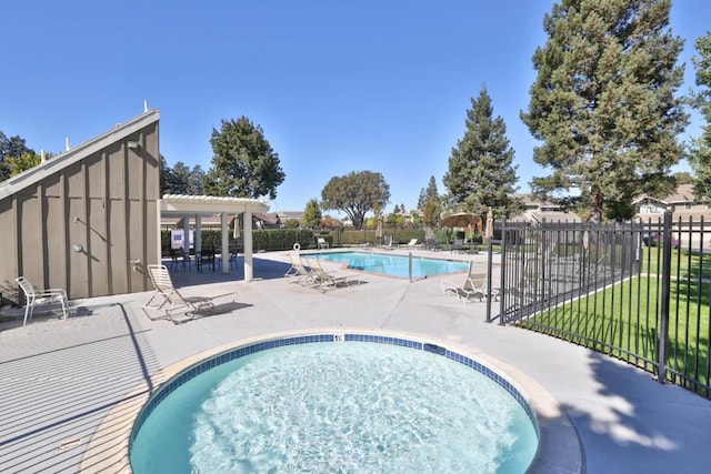 view of pool with a yard and a patio area