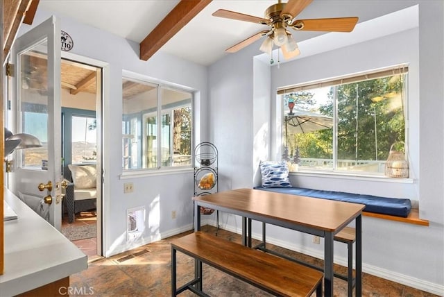 dining space with beamed ceiling and ceiling fan