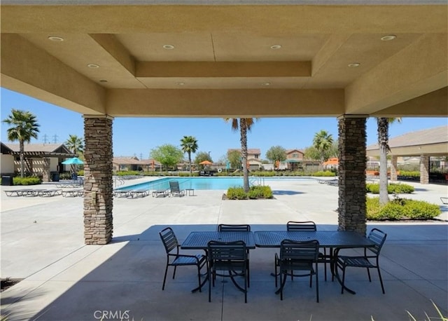 view of patio featuring a community pool