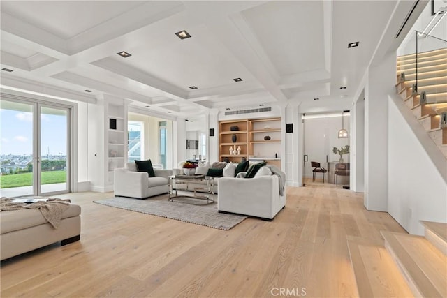 living room with beam ceiling, light hardwood / wood-style flooring, and coffered ceiling