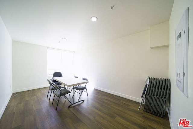 dining space featuring dark wood-type flooring