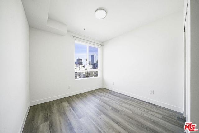 spare room featuring hardwood / wood-style floors