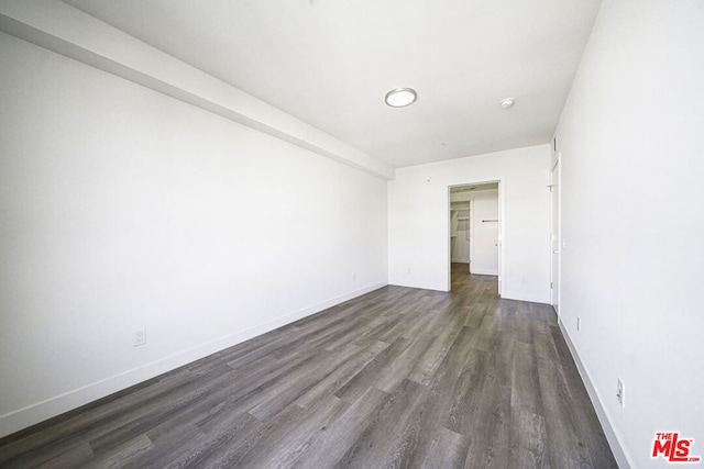 spare room featuring dark hardwood / wood-style floors