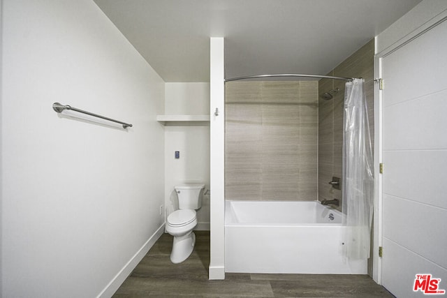 bathroom featuring toilet, wood-type flooring, and shower / tub combo