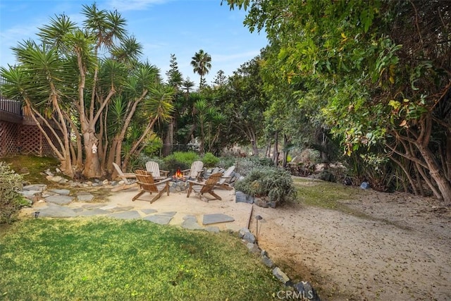 view of yard featuring a patio and a fire pit