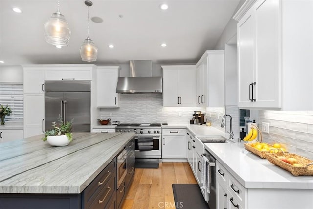 2308 S Ola Vis, San Clemente, CA 92672 - kitchen featuring white cabinetry, high end appliances, a sink, and wall chimney exhaust hood
