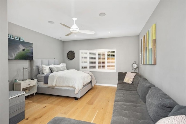 bedroom with ceiling fan and hardwood / wood-style floors