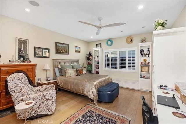 bedroom featuring light hardwood / wood-style flooring and ceiling fan