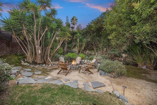 patio terrace at dusk with a fire pit