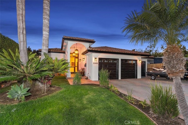 2308 S Ola Vis, San Clemente, CA 92672 - mediterranean / spanish-style home with an attached garage, driveway, a front yard, and stucco siding
