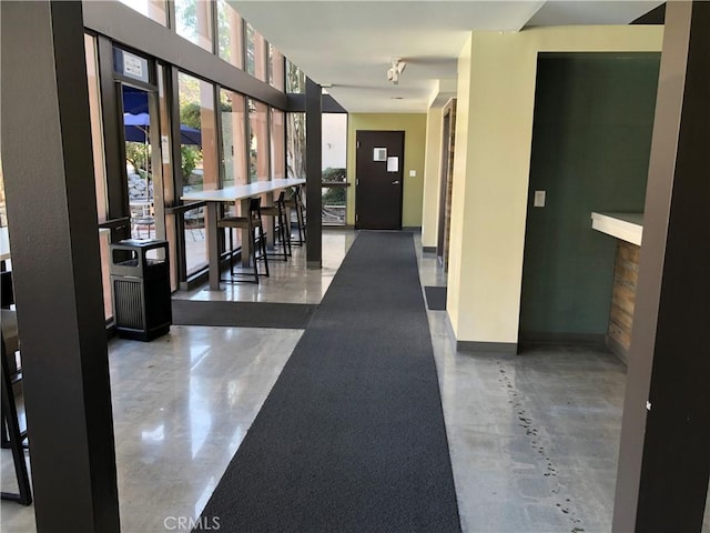 corridor featuring concrete flooring