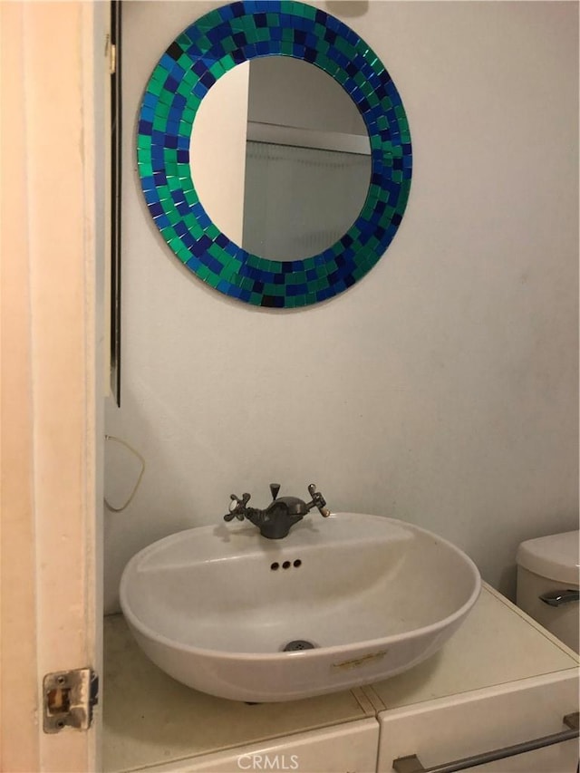 bathroom featuring sink and toilet