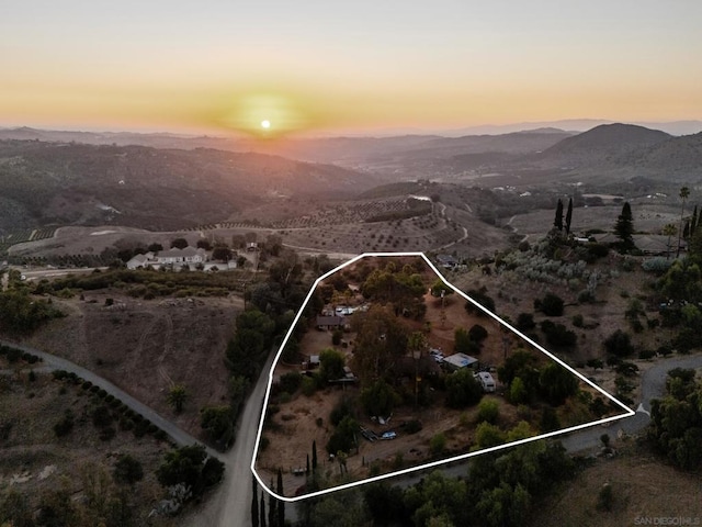 aerial view at dusk with a mountain view