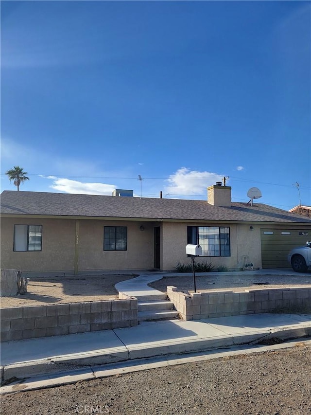 1912 Cortez St, Needles, CA 92363 - ranch-style house with stucco siding and a chimney