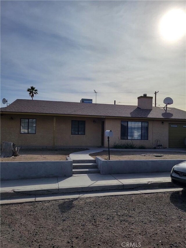 1912 Cortez St, Needles, CA 92363 - back of property with a chimney and stucco siding
