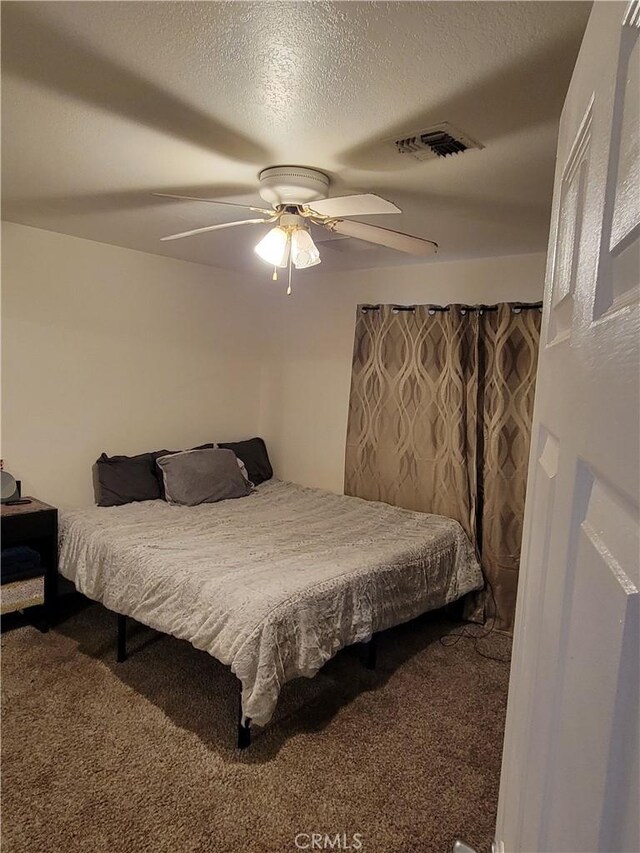 1912 Cortez St, Needles, CA 92363 - bedroom with carpet floors, ceiling fan, and a textured ceiling