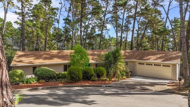 single story home with a garage