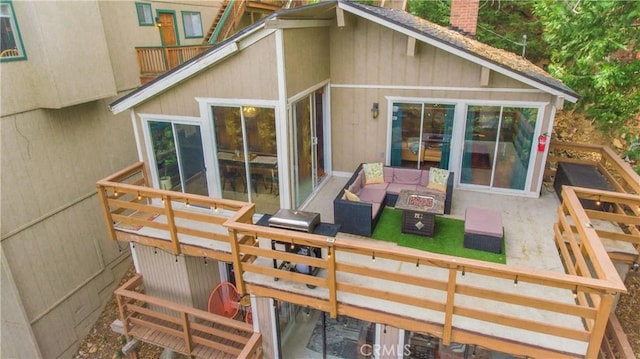 rear view of property with an outdoor living space