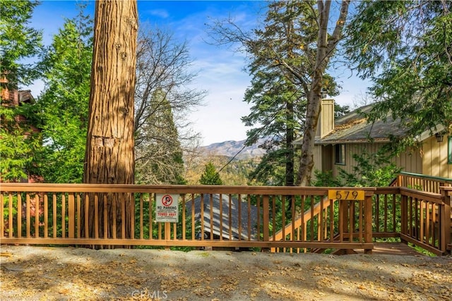 wooden deck featuring a mountain view