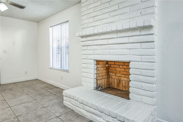 981 N Thorne Ave, Fresno, CA 93728 - living area featuring a textured ceiling, a ceiling fan, and light tile patterned floors
