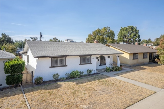 ranch-style house with a front lawn