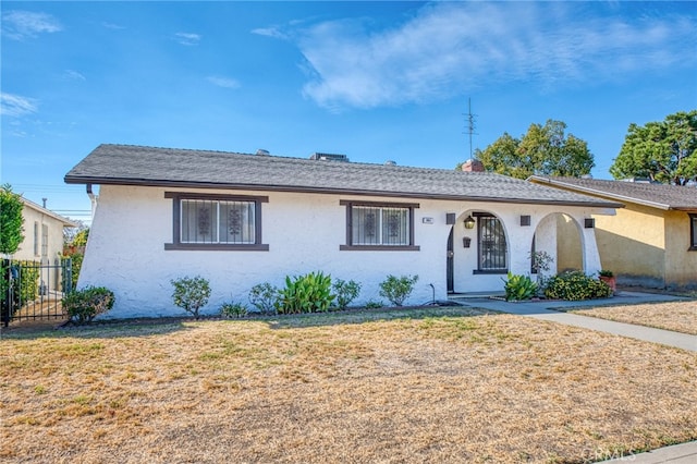 ranch-style house with a front lawn