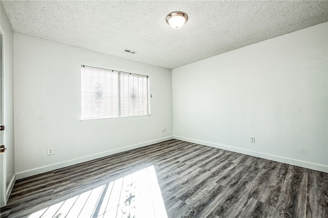 981 N Thorne Ave, Fresno, CA 93728 - spare room featuring wood finished floors and a textured ceiling
