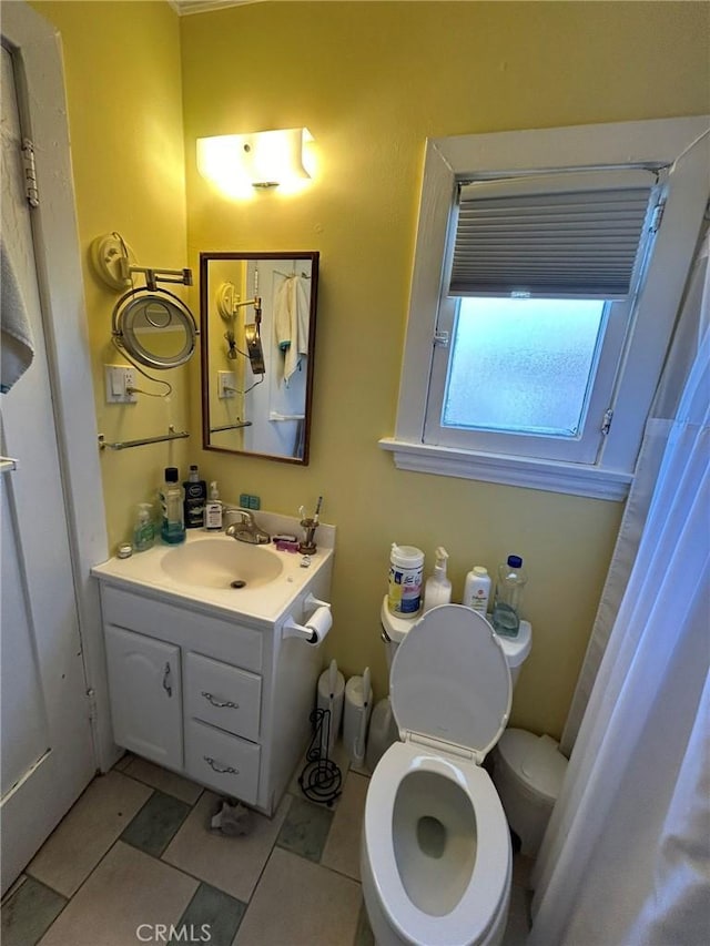 bathroom with vanity and toilet