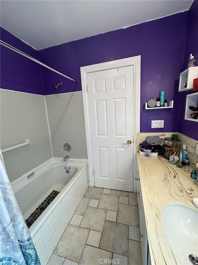 bathroom with vanity and shower / bath combination with curtain