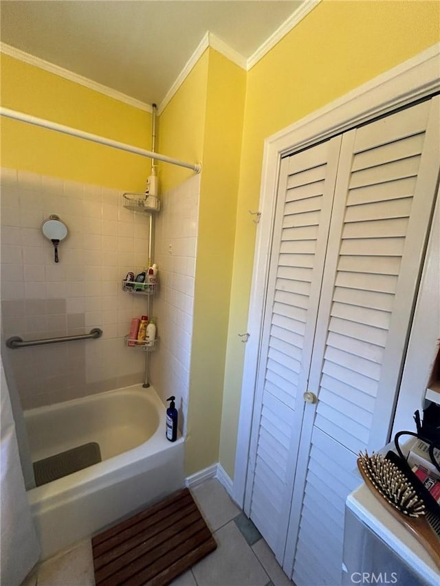 bathroom with tile patterned floors, tiled shower / bath combo, and crown molding