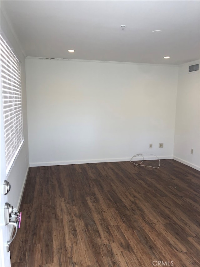 unfurnished room with dark hardwood / wood-style floors