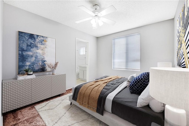 bedroom featuring ceiling fan and connected bathroom